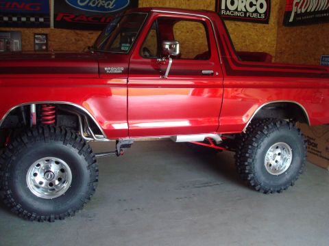 1978 Ford Bronco - This red Ford Bronco has been modified with a lift kit and oversized off-road tires.