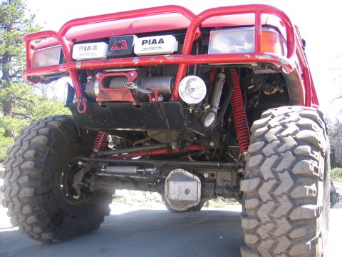 1989 Ford Bronco - The front of a modified 1989 Ford Bronco is shown with a custom bumper, winch, and off-road tires.