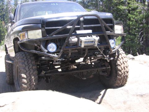 1989 Ford Bronco - This black truck features a winch and a heavy-duty off-road bumper, suggesting it is built for challenging terrain.