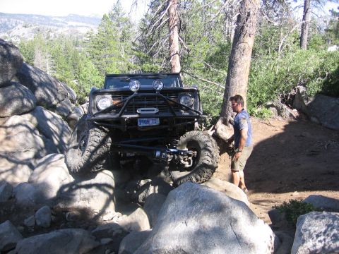 1989 Ford Bronco - This 1989 Ford Bronco is shown navigating a challenging rocky trail with a custom front bumper and winch.