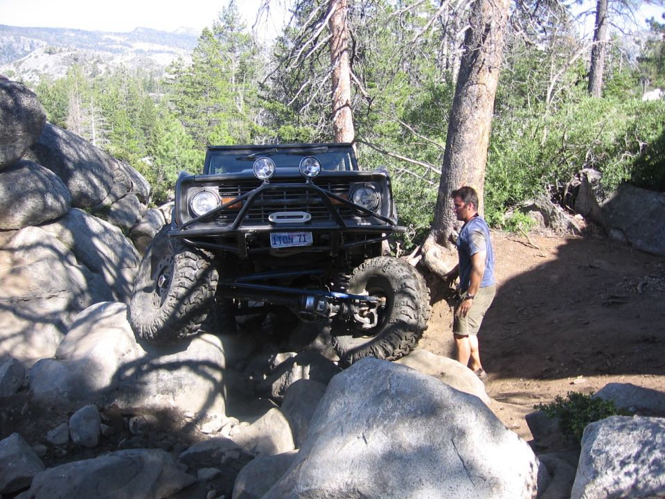 1989 Ford Bronco on rocks with custom bumper and winch