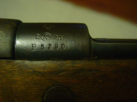 1979 Ford Bronco - Close-up shows serial numbers and markings on a firearm's metal receiver.