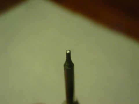 1979 Ford Bronco - A close-up view of a metal tool bit, possibly for a drill or driver.