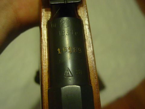 1979 Ford Bronco - Close-up of a gun receiver showing the year 1931 and a serial number.