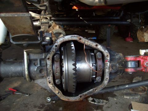 1995 Ford Bronco - Close-up view of an open differential housing, revealing internal gears and a copper wire detail.