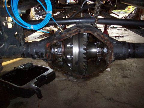 1995 Ford Bronco - Close-up of a vehicle's differential, showing internal gears and housing.
