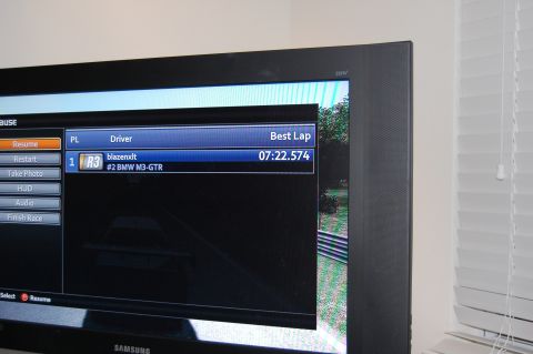 2002 BMW M3 - Racing game pause screen shows driver 'blazenxdt' with a best lap time of 07:22.574.