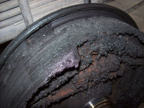 1995 Ford Bronco - This brake drum shows extensive damage and wear, indicating a critical failure.