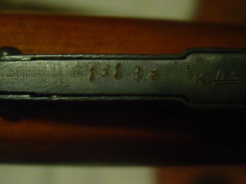 1979 Ford Bronco - Close-up view of a metal component showing stamped alphanumeric markings.