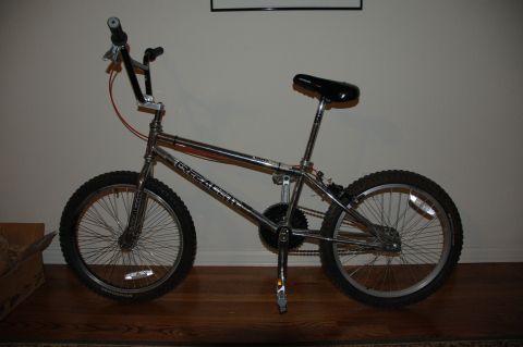 1998 BMW R1100GS ABS - A chrome BMX bicycle, possibly a Predator model, is shown parked indoors on a wooden floor.