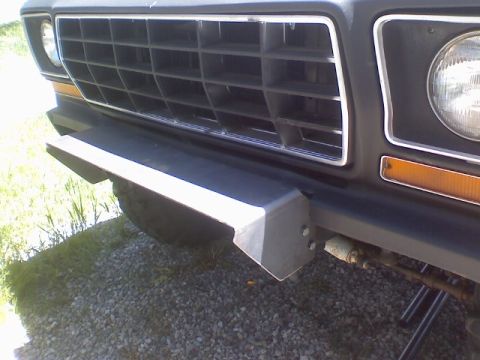 1978 Ford Bronco - Close-up of the front grille and a custom bumper on a 1978 Ford Bronco.