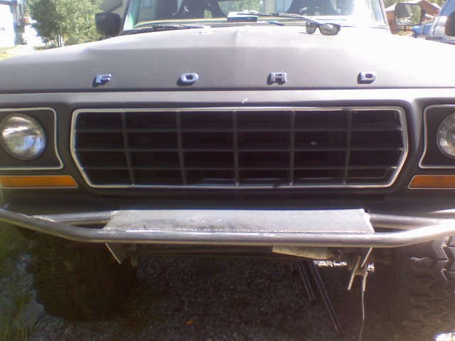 Dark gray 1978 Ford Bronco front grille with chrome trim and 'FORD' lettering