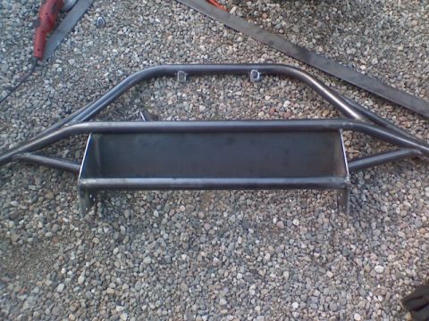 1978 Ford Bronco - A fabricated steel bumper, likely for an off-road vehicle, is shown before installation.