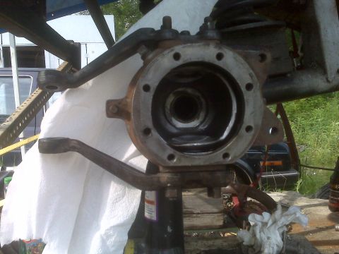 1987 Suzuki Samurai - Close-up of a vehicle's front axle assembly, showing mechanical components and signs of use.