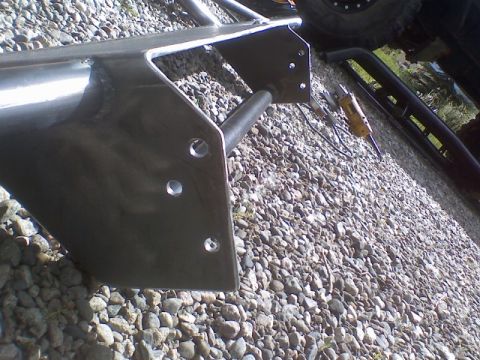 1978 Ford Bronco - Close-up view of a custom metal bumper being fabricated, showing mounting points and structural elements.