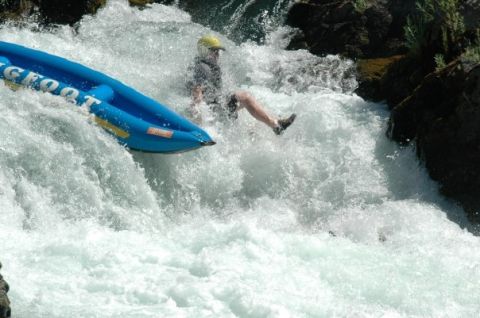 1994 Ford Bronco - A person in a blue raft navigates a turbulent waterfall.