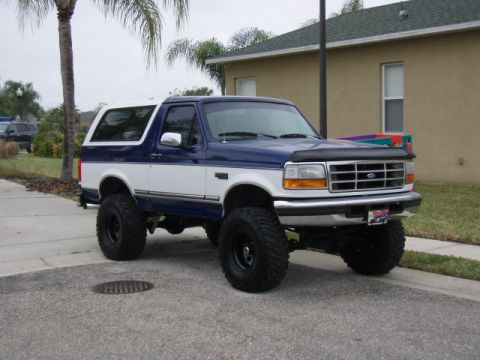 1996 Ford Bronco - This lifted 1996 Ford Bronco is parked on a residential street.