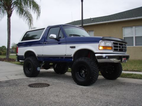 1996 Ford Bronco - This lifted Ford Bronco has a two-tone paint scheme and aggressive off-road tires.