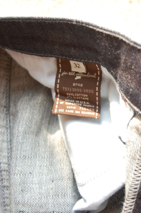 1968 Chrysler Town & Country - A close-up view of a clothing label showing size 32 and the brand '7 for all mankind'.