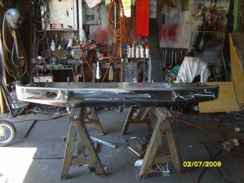 1989 Ford Bronco - Custom rear bumper being worked on in a garage setting.