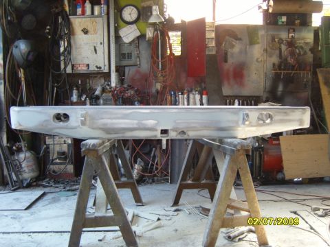 1989 Ford Bronco - Rear bumper for a 1989 Ford Bronco, shown in a workshop setting.
