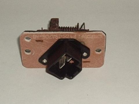 2007 Ford Mustang - A blower motor resistor with visible text and a rusty spring is shown against a neutral background.
