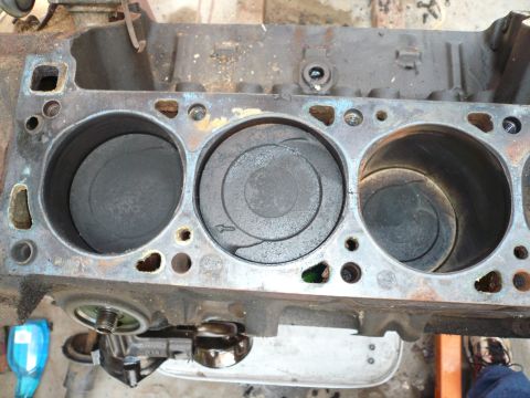 1975 Ford Ranchero - Close-up view of an engine block's cylinders and pistons, indicating wear and tear.
