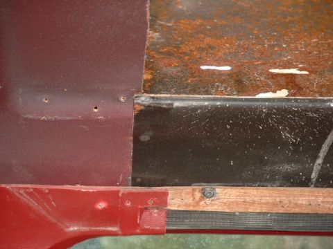 1990 Ford Bronco - Detail of aged metal and wood, showing signs of wear and rust.