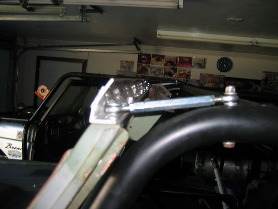 Interior view of a 1970 Ford Bronco with a custom roll cage and dashboard details