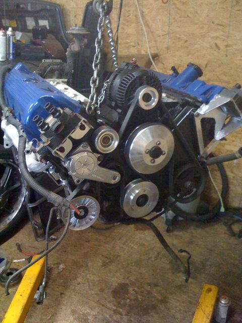 1996 Ford Crown Victoria - A close-up view of an engine assembly, likely undergoing maintenance or a rebuild.