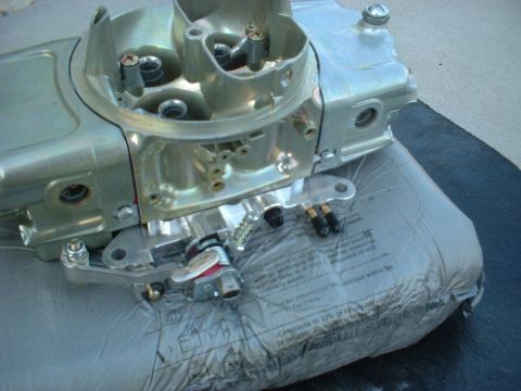 1968 Ford Galaxie - A close-up view of a carburetor, a critical engine component, is shown resting on packaging material.