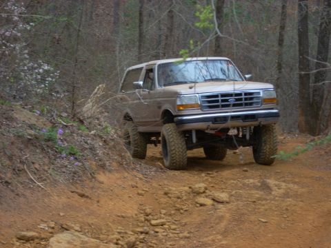 1996 Ford Bronco - This 1996 Ford Bronco navigates a muddy, wooded trail during an off-road event.