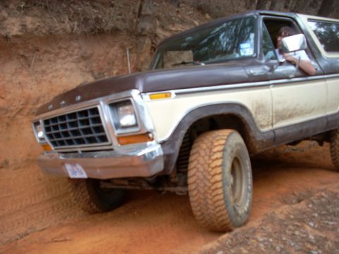1996 Ford Bronco - This two-tone Ford Bronco navigates a challenging off-road terrain.