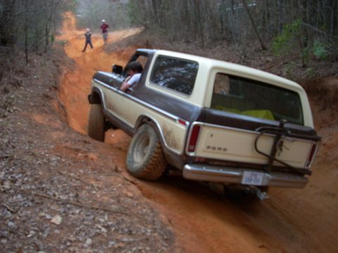 1996 Ford Bronco - Ford Bronco tackling a challenging off-road trail with steep inclines.