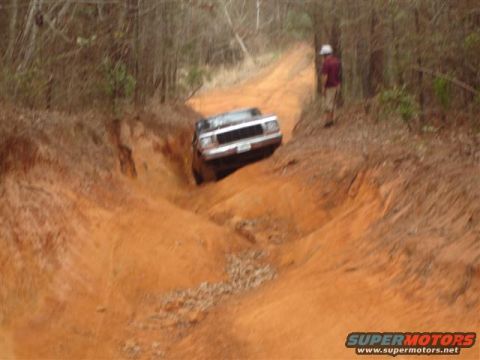 1996 Ford Bronco - This 1996 Ford Bronco navigates a challenging off-road trail, its capability on rough terrain.