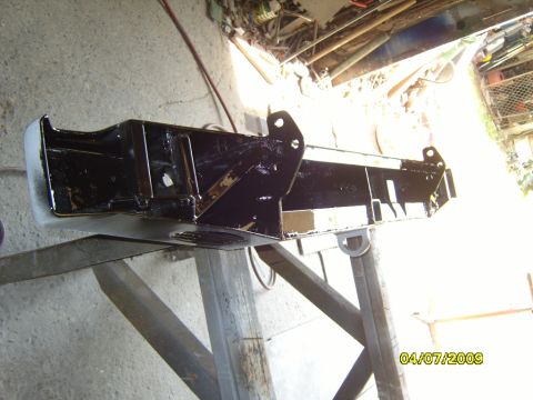 1989 Ford Bronco - A black rear bumper is shown mounted on a stand, with a visible date stamp indicating April 7, 2009.