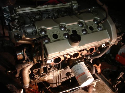 1990 Ford Taurus - Engine components are visible, including an oil filter with readable text.