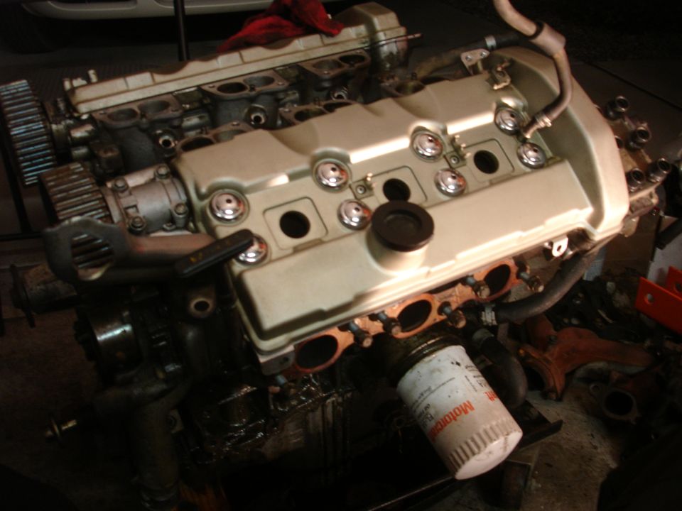 Engine with beige valve covers and visible oil filter