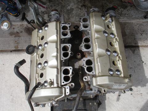 1990 Ford Taurus - Engine valve covers and intake manifold ports are visible in this close-up view.