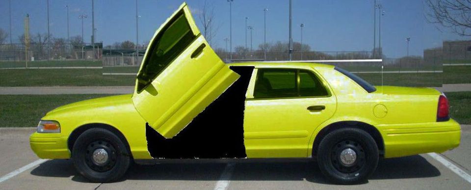 Yellow 2003 Ford Crown Victoria with custom lambo doors open