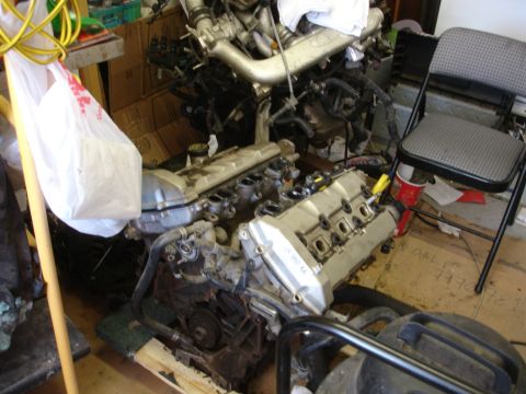 1992 Ford Taurus - Engine assembly with "3.8L V6" marking on the valve cover, likely for an engine swap rebuild.