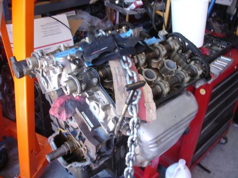 1992 Ford Taurus - Engine components are laid out on a stand, ready for assembly or repair.