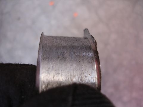 1992 Ford Taurus - Close-up of a damaged metal bearing, likely from an engine rebuild.