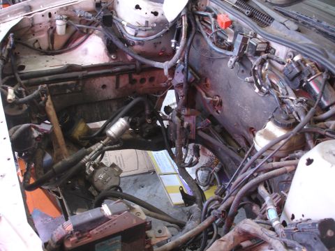 1992 Ford Taurus - The engine bay is shown with the engine removed, revealing the internal components and wiring.