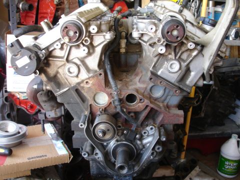 1992 Ford Taurus - Engine block assembly with various mechanical parts and wiring harnesses.