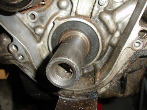 1992 Ford Taurus - This is a close-up view of an engine's crankshaft seal and surrounding metal components.