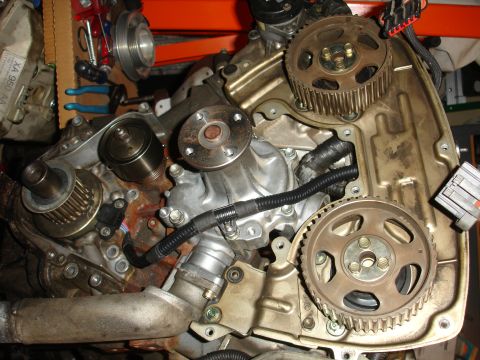 1992 Ford Taurus - Engine timing components including gears, water pump, and tensioner pulley are visible in this close-up.