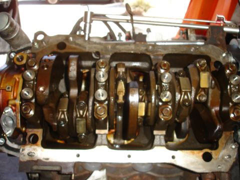 1992 Ford Taurus - Close-up view of an engine's crankshaft and connecting rods during a rebuild.