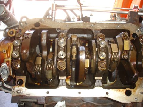 1992 Ford Taurus - Close-up view of the internal components of an engine, showing the crankshaft and connecting rods.