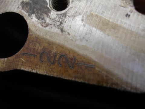 1992 Ford Taurus - Close-up of a metal component showing engraved markings.
